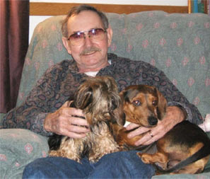 picture of man with pet dogs
