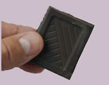 Chocolate and Health article link; thumb of piece of dark chocolate