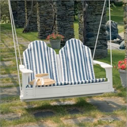picture of wooden bench swing over grass with embedded stone pavers