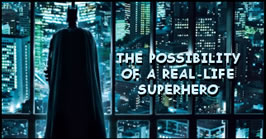 image of Batman looking our over the city; feature story is Becoming Batman - The Possibility of a Real-Life Superhero