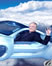 thumb of man waving from flying car