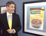 funny natural foods video link; thumb of spokesman pointing to natural sign