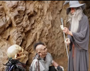 funny Gandalf video link; thumb of Gandalf showing card trick to two orcs