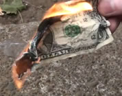 video about silver manipulation link; thumb of US dollar burning