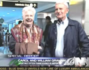 funny thanksgiving travel video link; thumb of happy older couple at airport