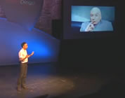 reasons to garden video link; thumb of Roger Doiron on stage; Dr. Evil on screen in background