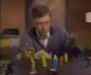 bill gates looking at Star Wars toy figures on his desk top; link for funny animation/video; opens in new window