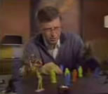 bill gates looking at Star Wars toy figures on his desk top; click to see animation/video at external site; opens in new window