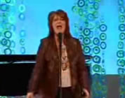 photo of woman on stage singing; link for funny animation/video; opens in new window