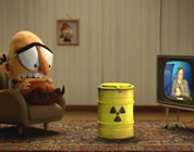 nuclear waste solutions videos link; thumb of man sitting in livingroom with TV and a drum of nuclear waste